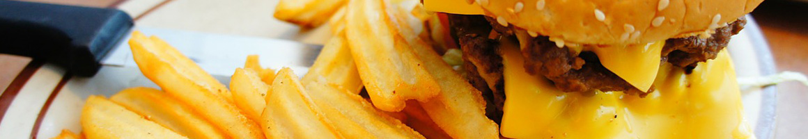 Eating American (Traditional) Burger Comfort Food at Alamo Springs Café restaurant in Fredericksburg, TX.